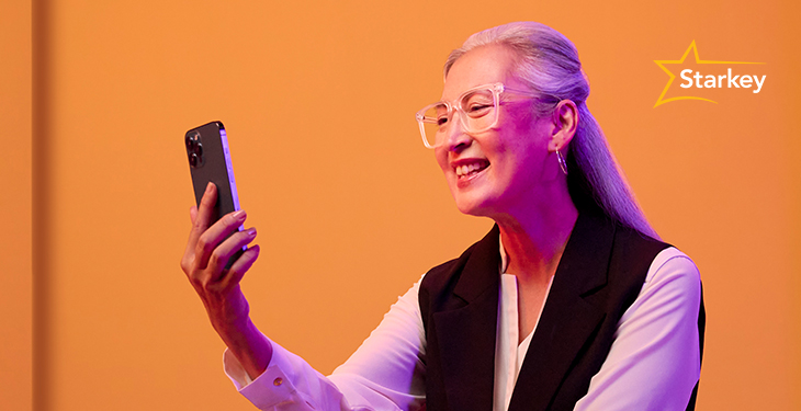 Image of a woman using a hearing aid program